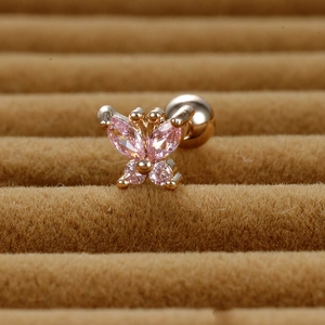 Macro detail of butterfly earring with pink zircon crystals and screw back ball closure