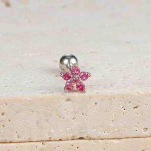 Macro view of flower stud earring with pink zircons and threaded ball back closure