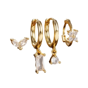 Elegant 4-piece gold earrings set featuring marquise zircon flowers and geometric charms