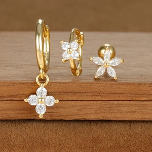 Detailed macro view of gold plated earrings set with cubic zirconia and S925 hallmark