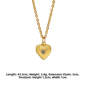 Close-up of gold heart locket necklace with blue birthstone and dimension markings
