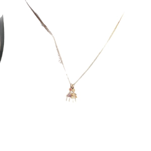 Gold necklace with boy and girl pendants featuring red and white zircon birthstones