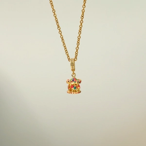 Elegant gold carousel pendant necklace with colorful enamel detailing and sparkling zircons