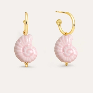 Detail of gold-plated earrings featuring pink conch shell pendants on white background