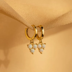 Elegant 18K gold-plated hoop earrings featuring three triangle-set white opal stones