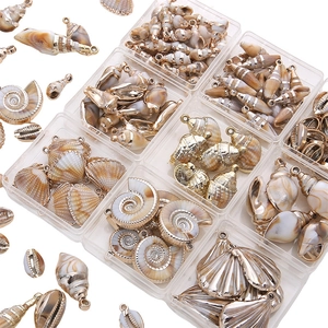DIY acrylic ocean shells pendants with gold metal edges in transparent storage box