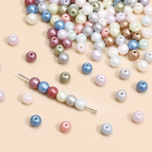 Multi-colored 4mm glass pearl beads for jewelry making, featuring a soft pearlescent luster