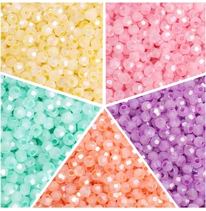 Detail view of multifaceted glass seed beads in five aurora colors for DIY jewelry making