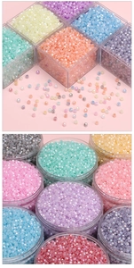Macro shot of colorful faceted glass seed beads in macaron tones for DIY jewelry making