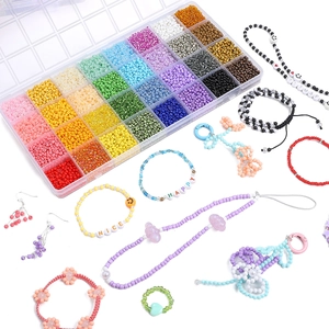 Detailed view of 24-compartment rainbow seed bead kit with DIY jewelry craft examples
