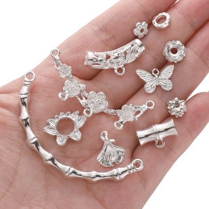 Silver alloy jewelry accessories set with butterfly and lotus leaf charms in hand
