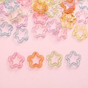 Macro view of hollow star-shaped acrylic pendants for DIY jewelry and crafts in pastel colors
