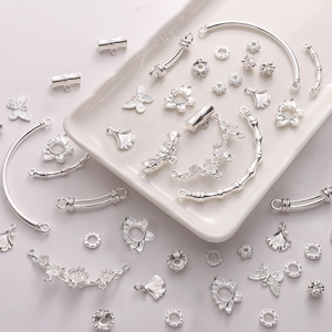 Silver DIY jewelry findings with hollow lotus, butterfly, and bamboo alloy components
