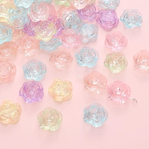 Macro detail of 18mm transparent rose resin beads with holes for DIY jewelry making