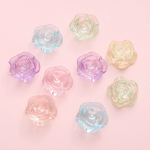 Macro detail of 18mm translucent resin rose flower beads for DIY craft jewelry making