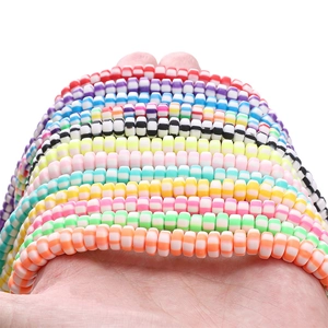 Macro shot of 6x3mm colorful striped polymer clay disc beads for DIY jewelry making