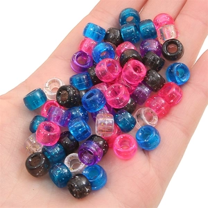 Close-up of colorful translucent acrylic beads with glitter for DIY jewelry making