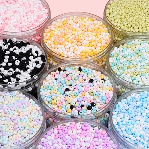 Macro shot of 4mm teardrop glass seed beads in various colors for DIY jewelry making