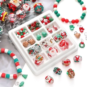 Detailed view of Christmas themed resin charms and beads in white 12-slot organizer box