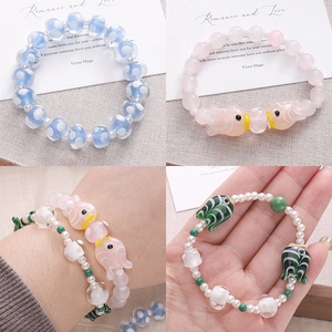 Handmade lampwork bead bracelet with goldfish pendant and colorful glass charms