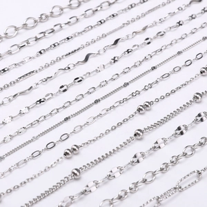 Assorted silver stainless steel DIY jewelry chains including cross and figaro styles