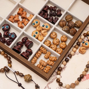 Handcrafted Chinese zodiac snake wooden beads and animal pendants in a display box