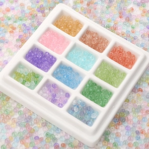 Macro shot of 12-color assorted 2x4mm translucent abacus beads for DIY jewelry making