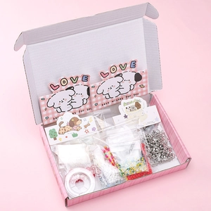 Unboxed view of puppy DIY bead kit with various colorful beads and gift packaging