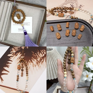 Traditional wood beaded car hanging with sandalwood, turquoise accents and purple tassel