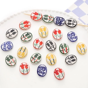 Detail of colorful hand-painted tulip ceramic beads for DIY jewelry and bracelets