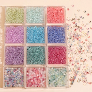 Macro view of 12-grid set with colorful translucent glass beads for DIY jewelry making