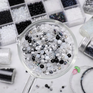DIY black and white glass bead assortment kit for jewelry making in a storage box