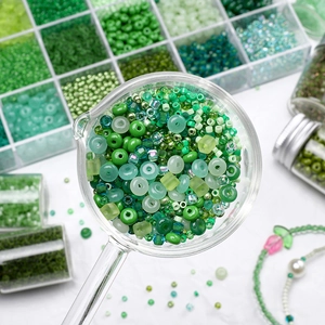 Green glass bead assortment for DIY jewelry making in various shades and shapes