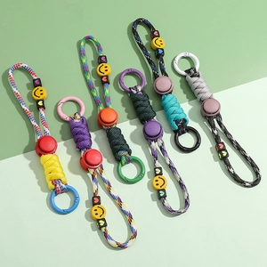 Portachiavi in paracord intrecciato con perline sorridenti e moschettoni in plastica colorata