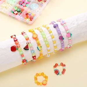 Close-up of DIY fruit themed beaded bracelet kit with colorful acrylic and polymer clay beads