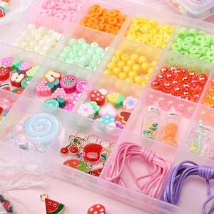 DIY summer fruit jewelry kit with clay beads and charms in a transparent storage box