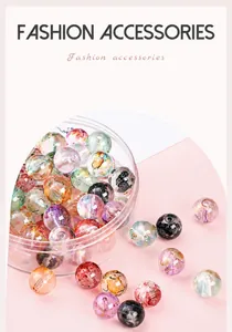 Detail of ice-clear glass beads with ink wash patterns and gold foil flakes for DIY jewelry