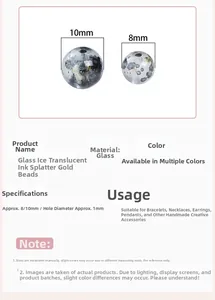 Detailed view of ink-washed glass beads with gold specks for DIY jewelry making