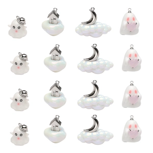 Macro view of sixteen resin charms featuring ghosts and moon shapes for DIY jewelry making