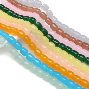 Macro detail of colorful polished barrel-shaped glass beads for DIY jewelry making