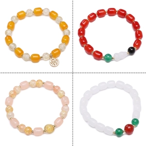 Detail view of four DIY handmade beaded bracelets with charms in a grid layout
