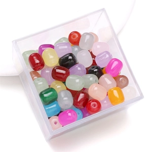 Colorful glass jade barrel beads set in a clear plastic organizer for DIY jewelry making
