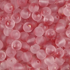 Macro detail of pink frosted glass beads with gold foil and red speckles for DIY jewelry