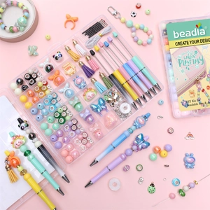 DIY beaded pen set with colorful beads, panda charms and tassels in storage box