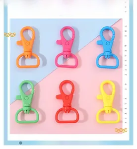 Detailed view of colorful plastic lobster clasps with D-ring bases for DIY keychains
