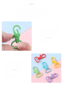 Macro detail of colorful rotating plastic lobster clasps in candy colors for DIY keychains