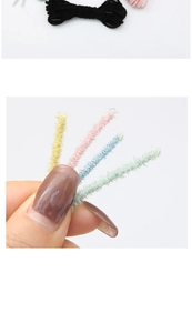 Macro shot of colorful fuzzy craft stems showing detailed soft texture for DIY projects