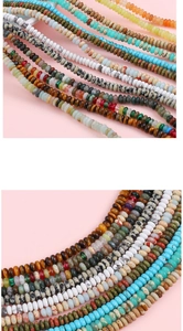 Macro shot of colorful flat round natural stone beads with smooth textures and mineral patterns