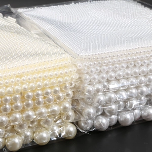 Detailed view of assorted ABS imitation pearls in multiple sizes for DIY jewelry projects