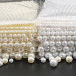 Glossy ABS faux pearls in white and cream for DIY jewelry making and handicraft